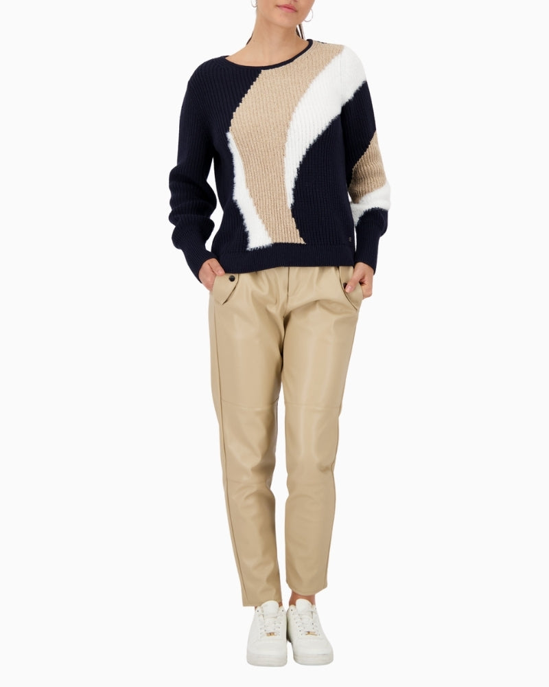 Model wearing Monari sweater styled casually with jeans