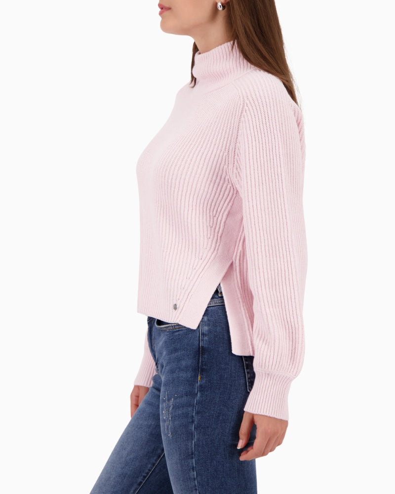 Woman wearing Monari rose knit pullover side view showing side slits – Áines Boutique