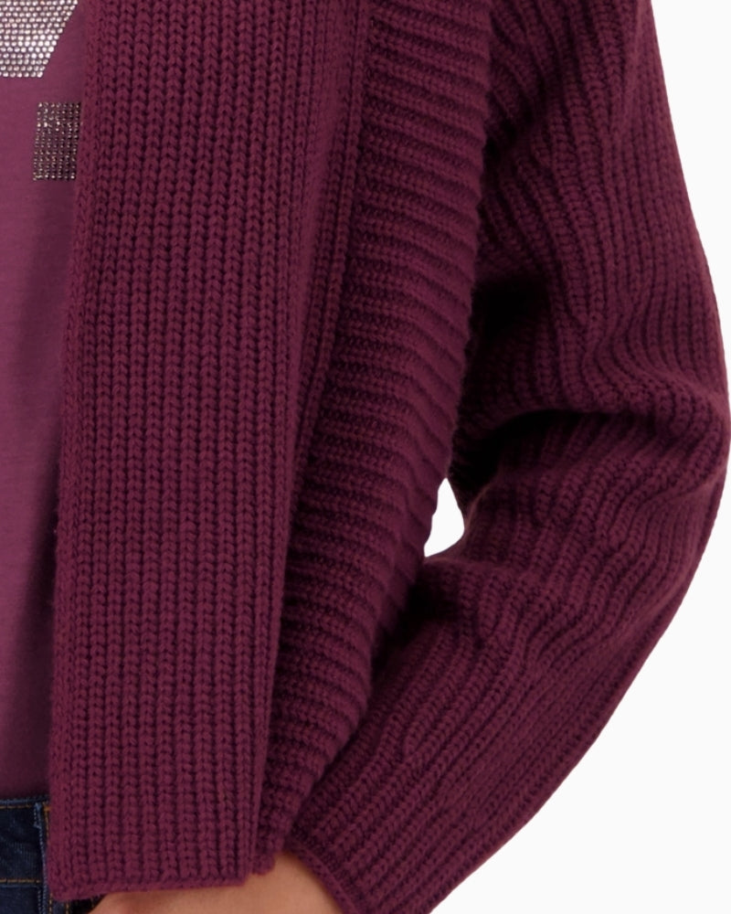 Close up view of relaxed-fit knit throw with dropped shoulders
