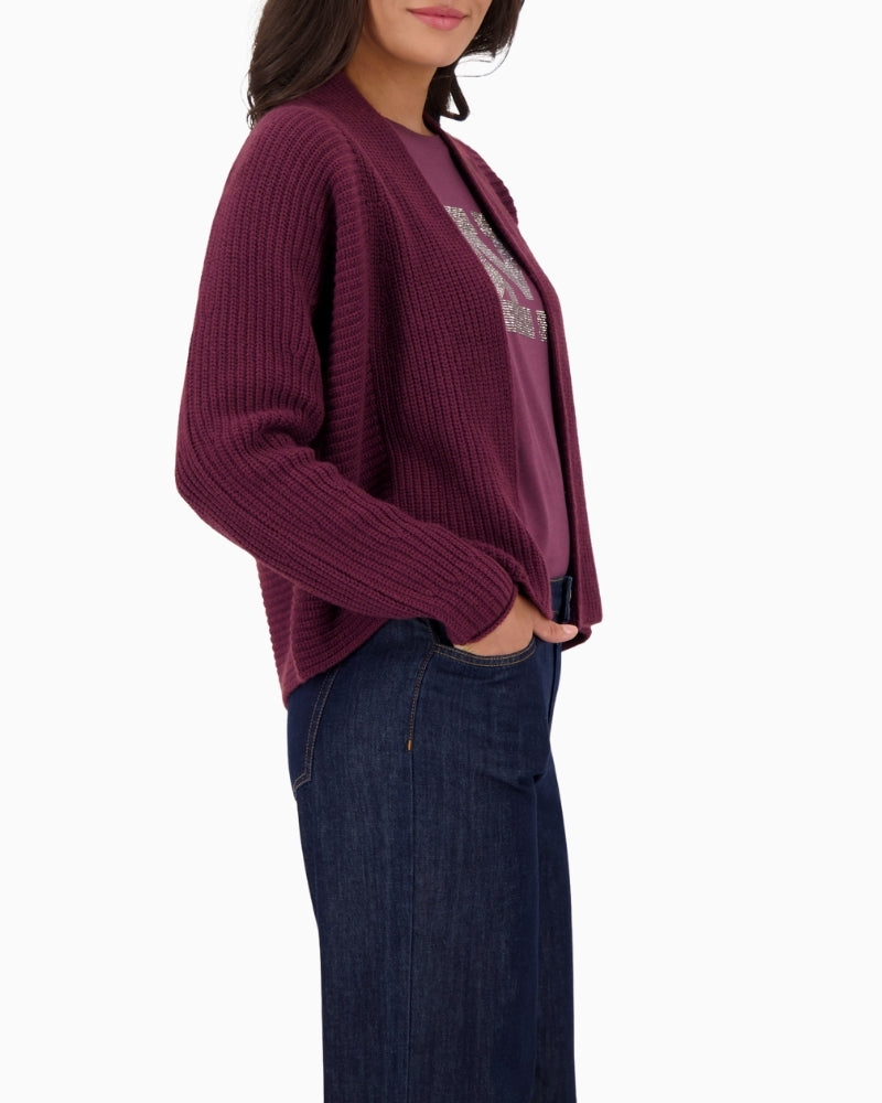 Side view of relaxed-fit knit throw with dropped shoulders