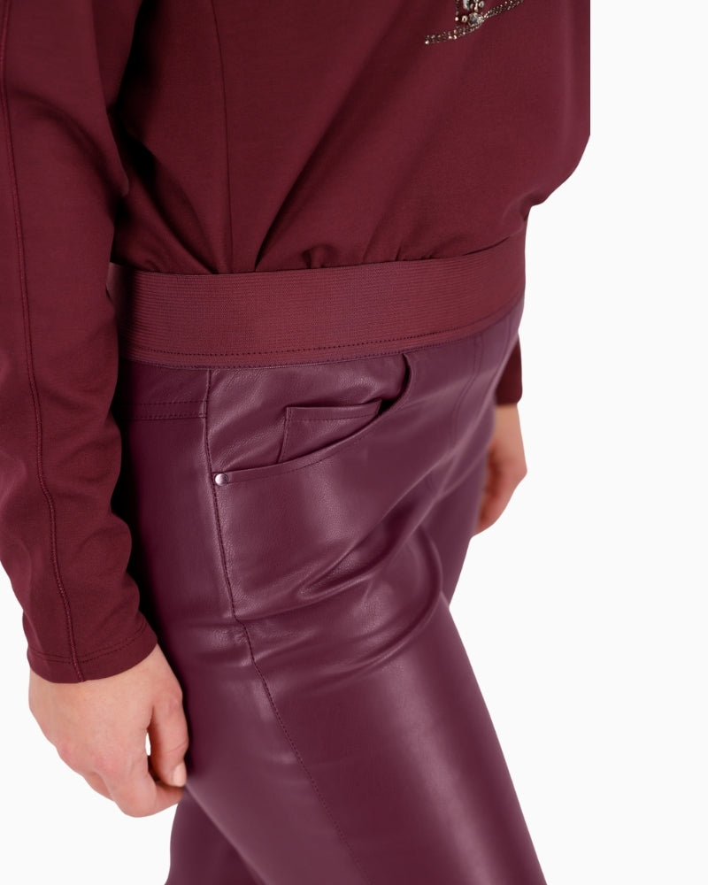 Close-up of sleek leather-look fabric and side pocket detail