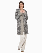 Front view of Monari leopard print knitted coat with lapel collar and button fastening