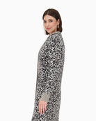 Side view of Monari leopard print knitted coat with lapel collar and button fastening