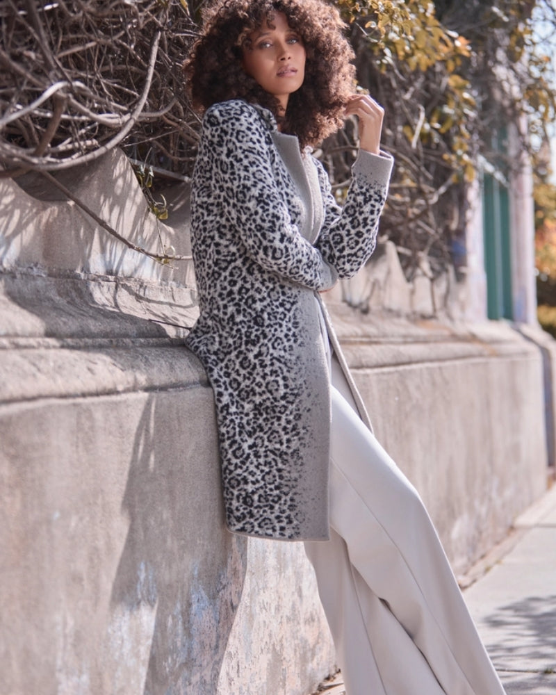 Leopard knit coat by Monari styled with black top and jeans for a casual look