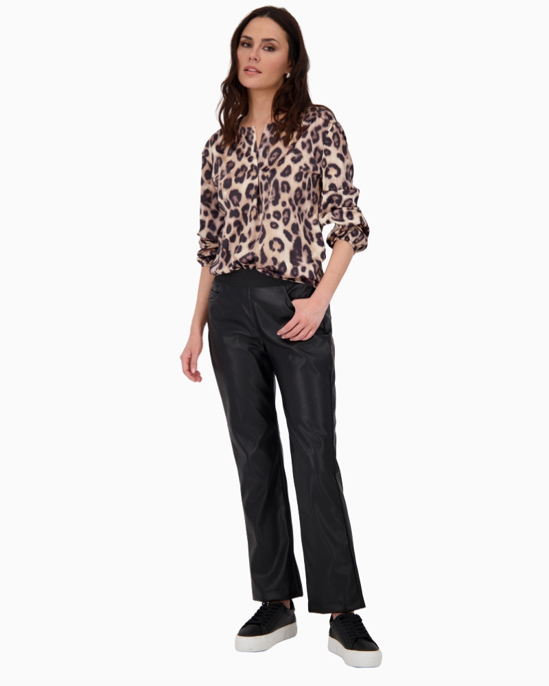 Model wearing blouse with black trousers for everyday look