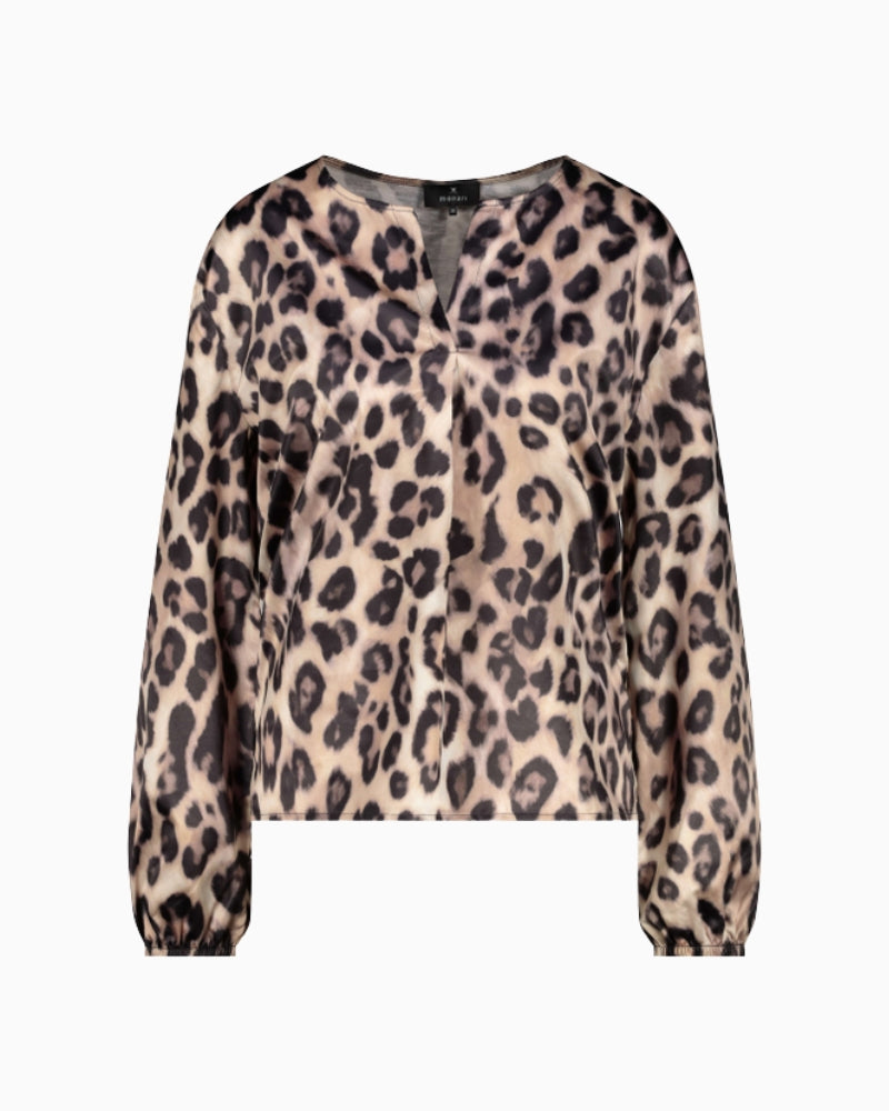 Detail of neckline and shoulder seam on printed blouse