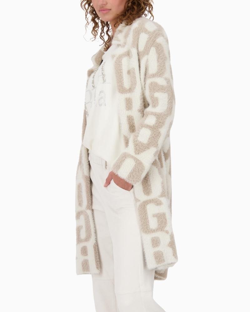 Side view of cotton blend jacket with lettering and ⅞ sleeves