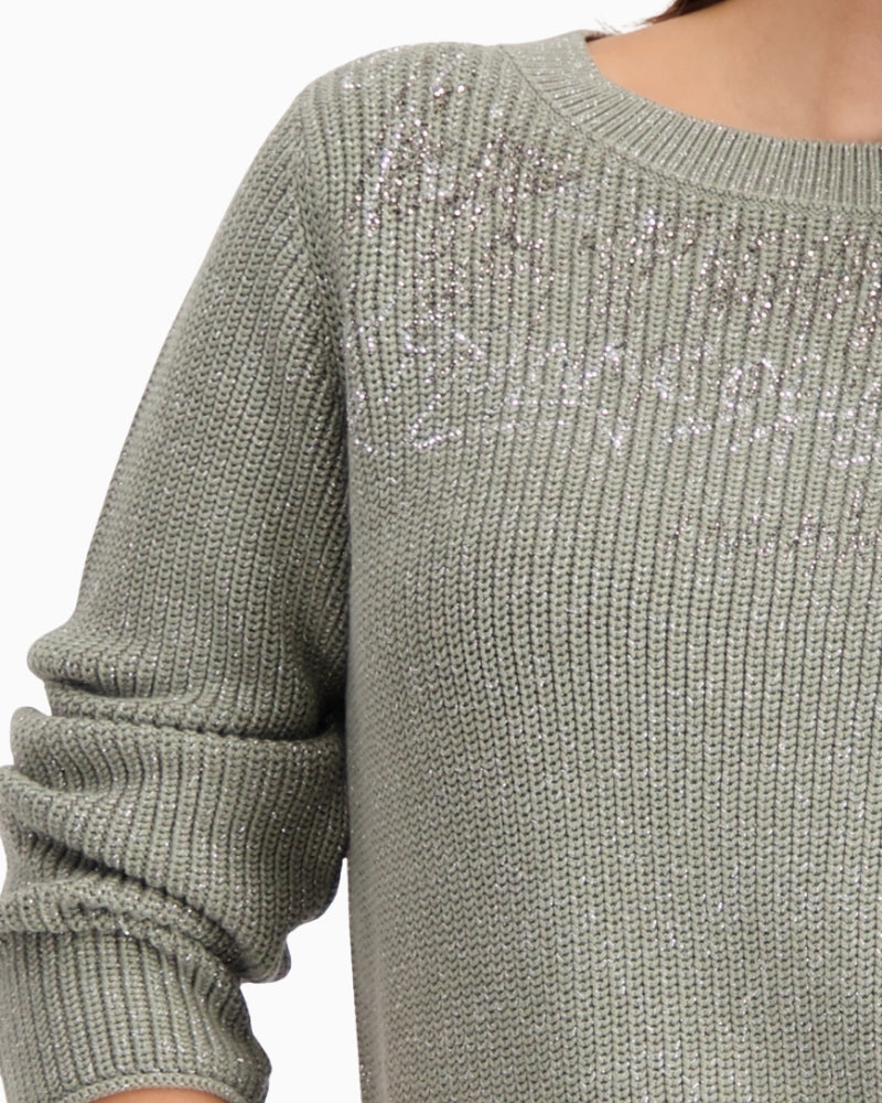 Close-up of rhinestone detail and metallic thread in Monari knit
