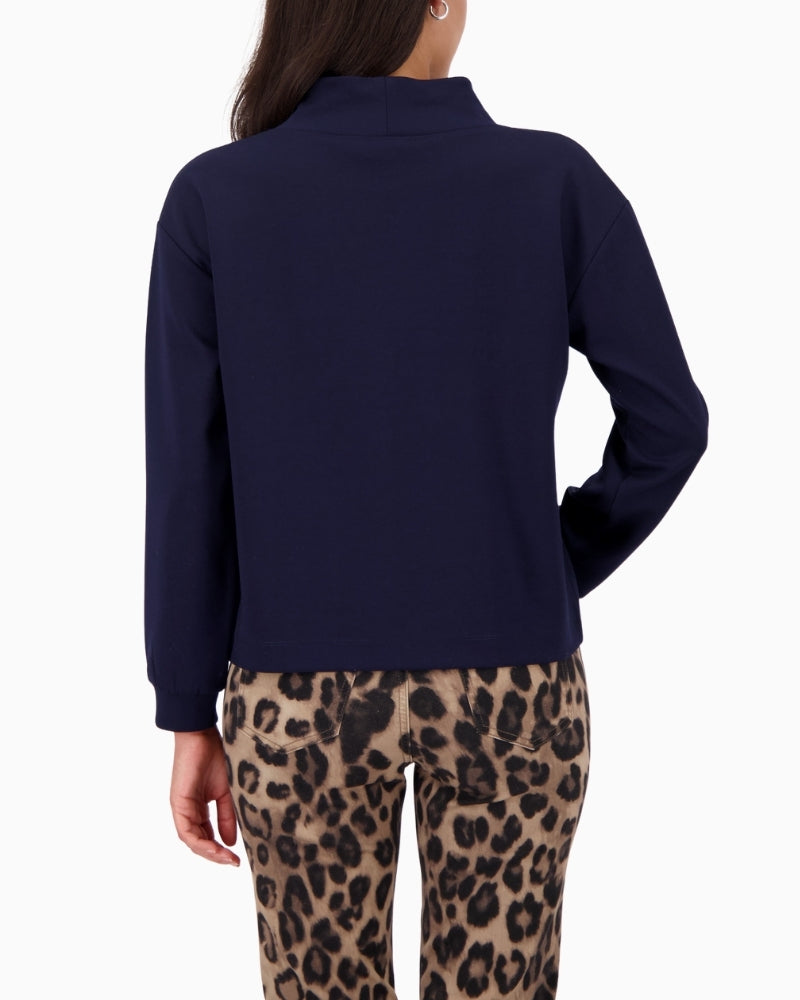 Back view of relaxed-fit Monari top with long sleeves