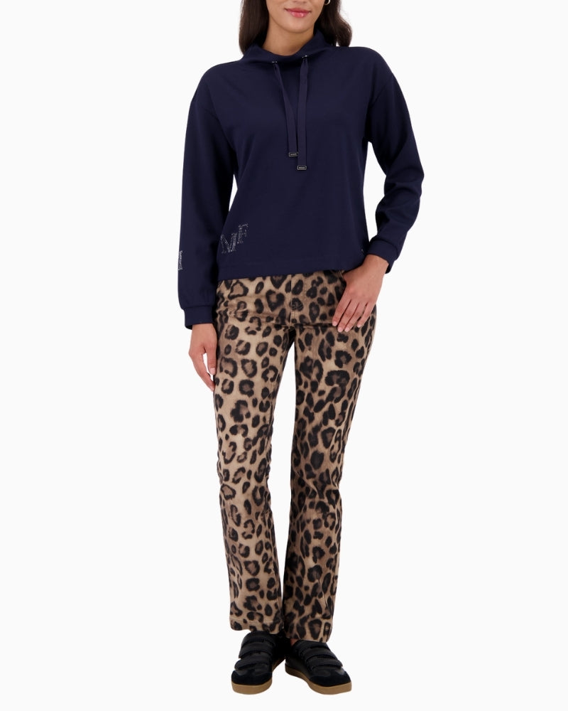 Model wearing Monari sweatshirt styled casually with trousers