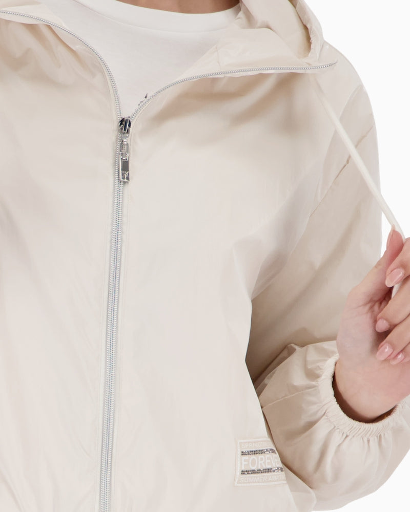 Close-up of Monari outdoor jacket sleeve zip pocket detail – Áines Boutique