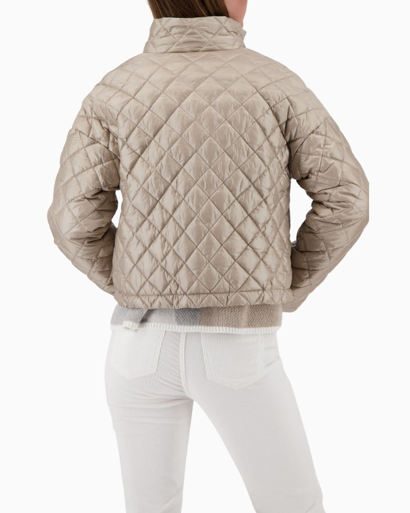 Back view of lightweight padded jacket with quilted panels