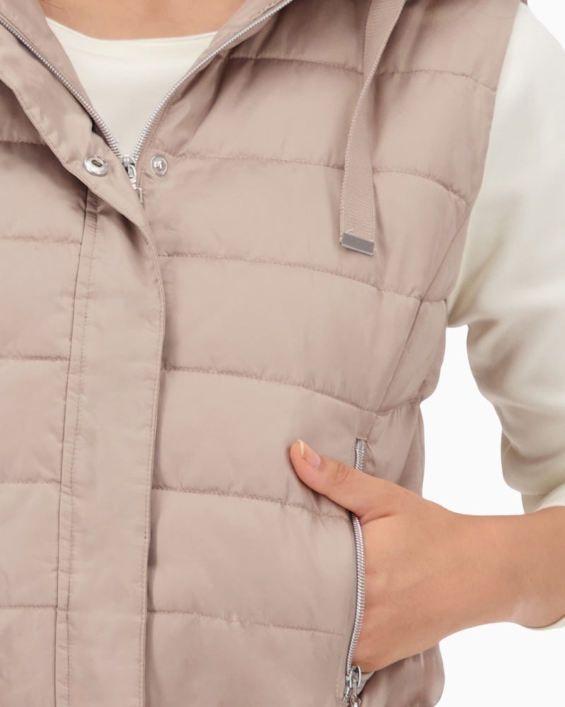 Detail of zip and button placket on lightweight polyester vest