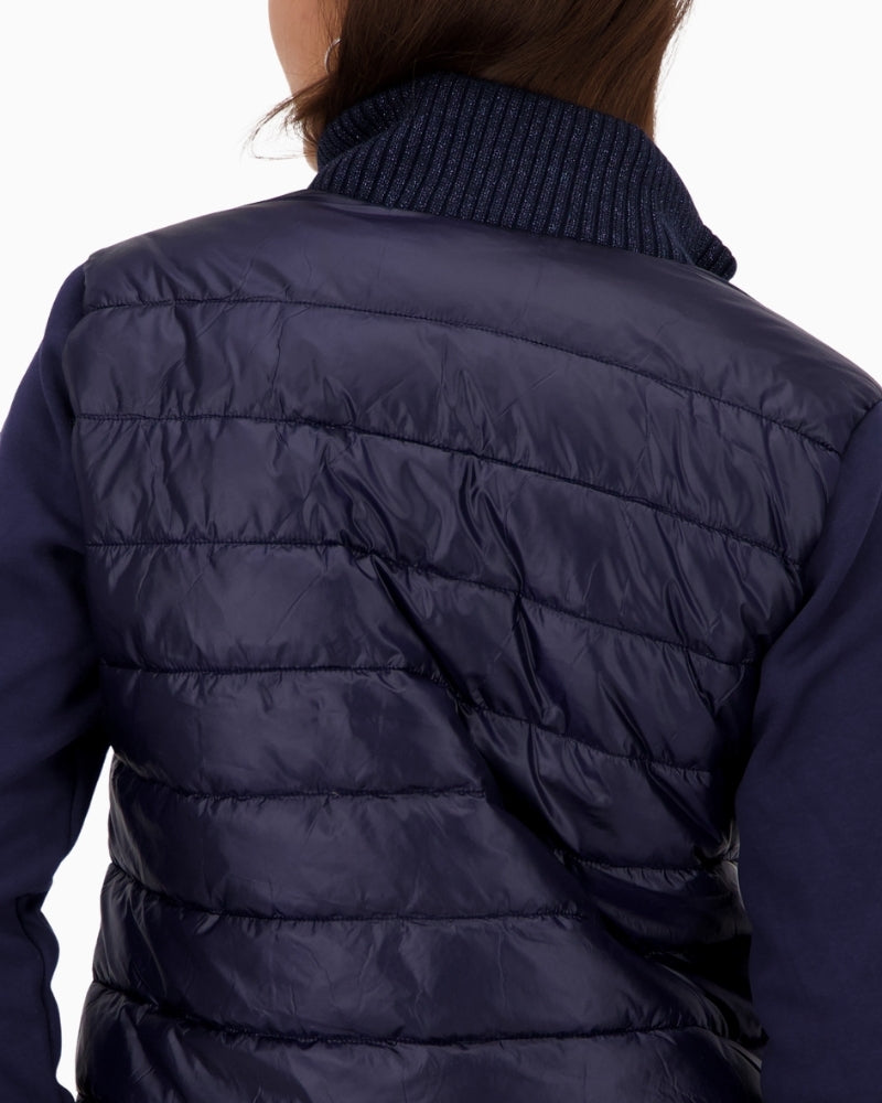 Back view of quilted jacket with soft stretch panels