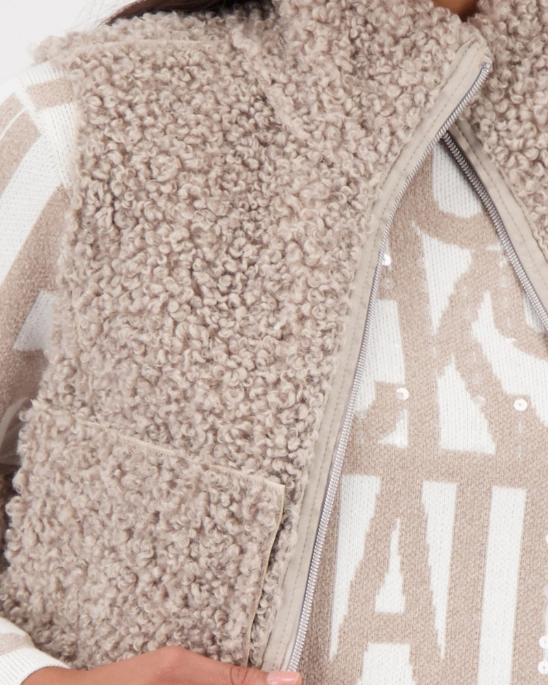 Close-up of patch pocket and texture detail on faux fur side