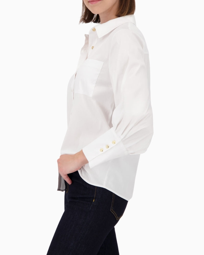 Side view of blouse showing pleat detail and soft poplin fabric