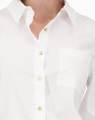 Close-up of button placket with subtle metallic detailing
