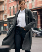 White long-sleeve blouse styled with trousers for a polished look