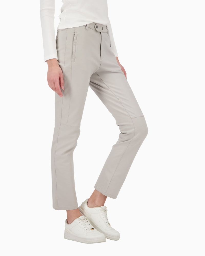 Side profile of straight-leg coated trousers by Monari