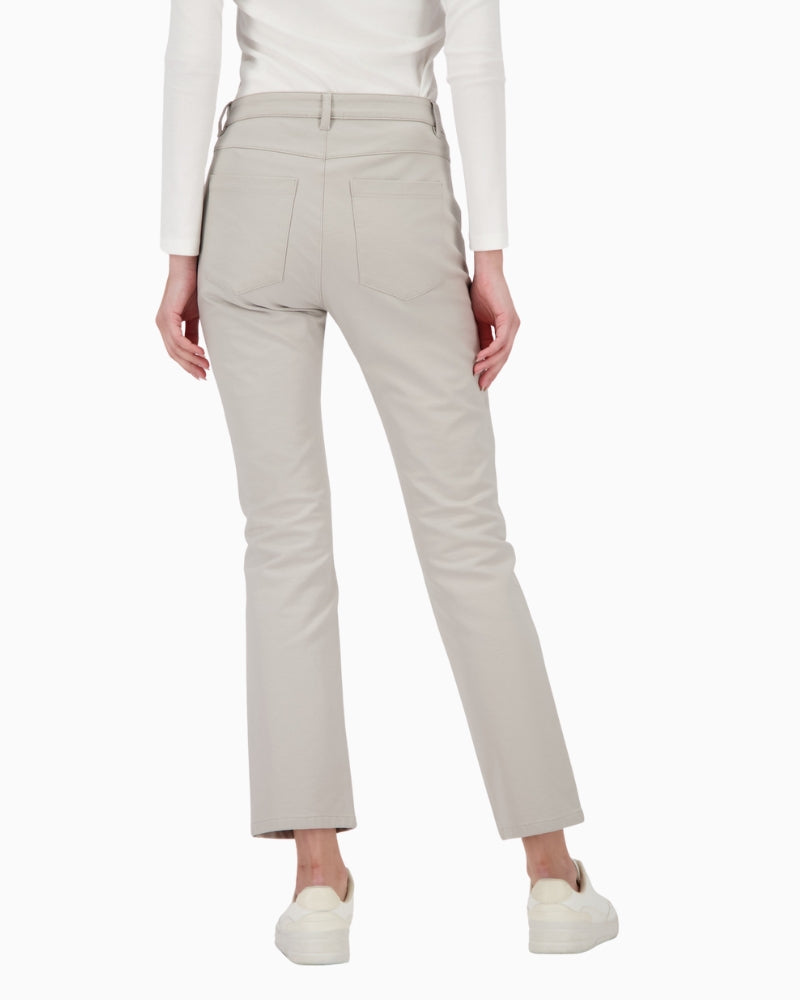 Back view of black leather-look trousers with patch pockets