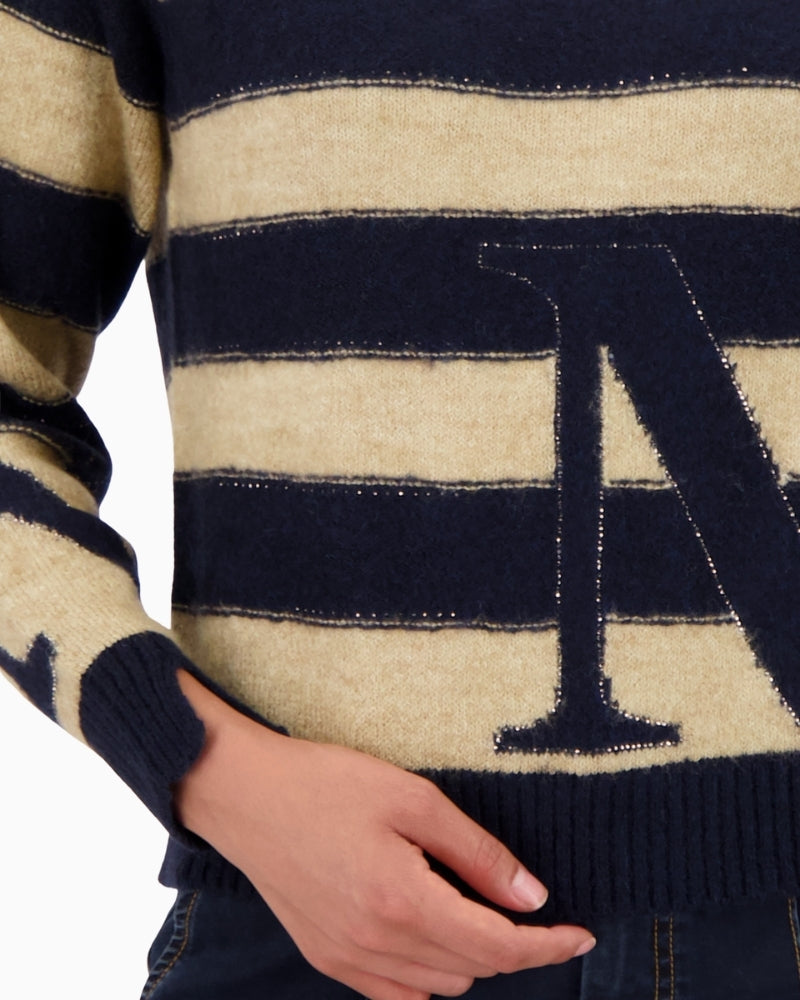 Close-up of rhinestone detail and stripe pattern on Monari pullover