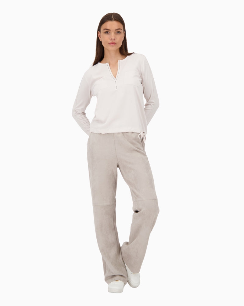 Blouse styled with trousers for a polished, smart-casual look