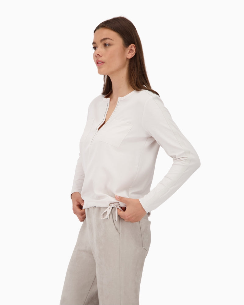 Side view showing stripe detail on sleeves and flowing fabric