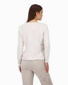 Back view of beige blouse with soft stretch material