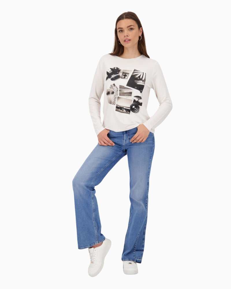 Model wearing Monari long sleeve top with denim jeans and rubber shoes