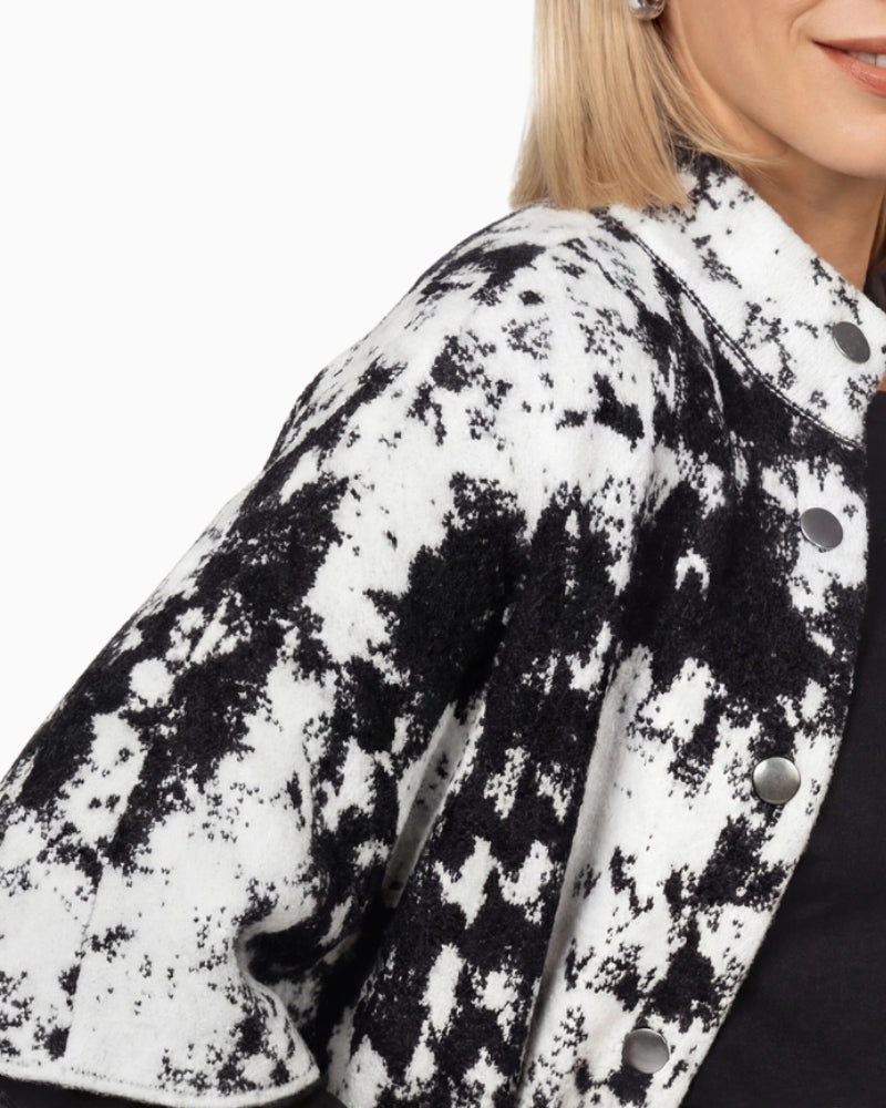 Monari Jacquard Knit Cape in black and white button placket detail