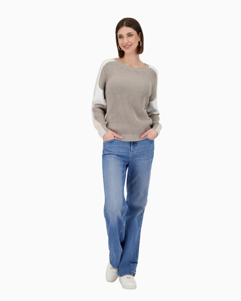 Model wearing the Monari jumper styled with jeans for a casual daytime look