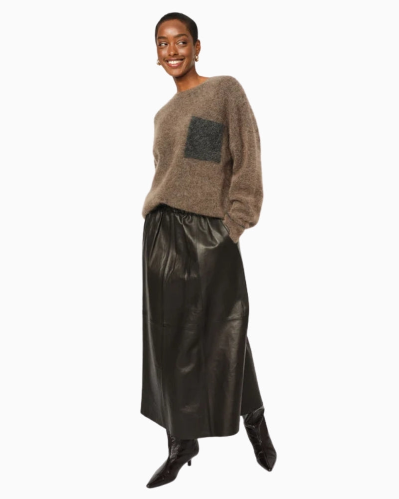 Model wearing soft Mos Mosh jumper styled casually with jeans for everyday wear