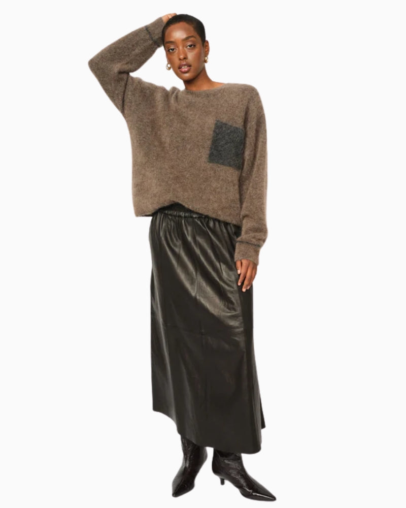 Model wearing soft Mos Mosh jumper styled casually with jeans for everyday wear