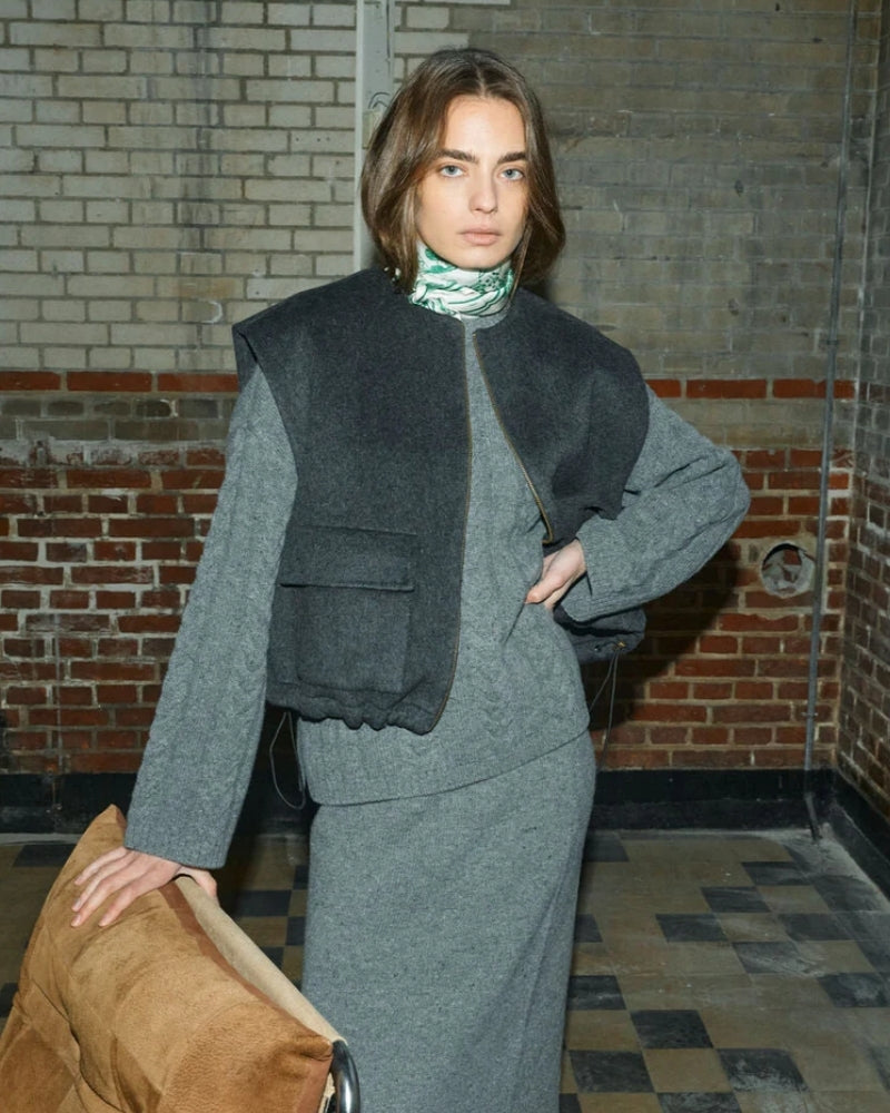 Close-up of adjustable drawstring hem and textured wool blend