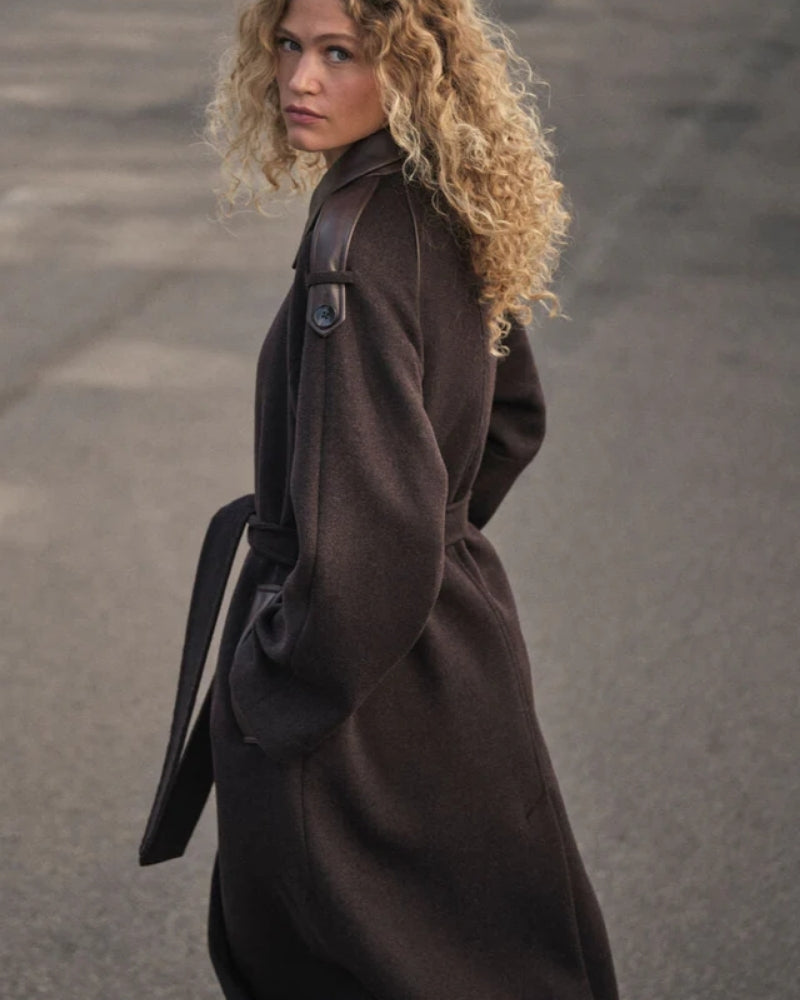 Close-up of leather detailing on shoulder strap and collar of wool-blend coat