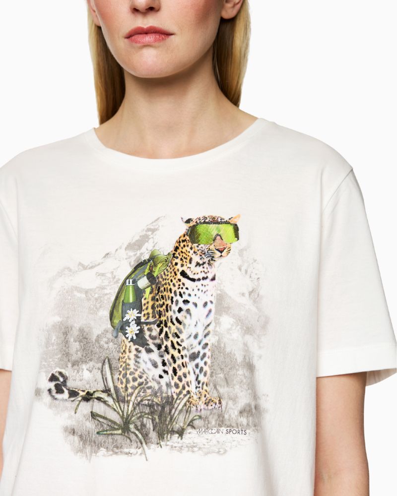 Close up view of white Mos Mosh tee with graphic leopard wearing rucksack