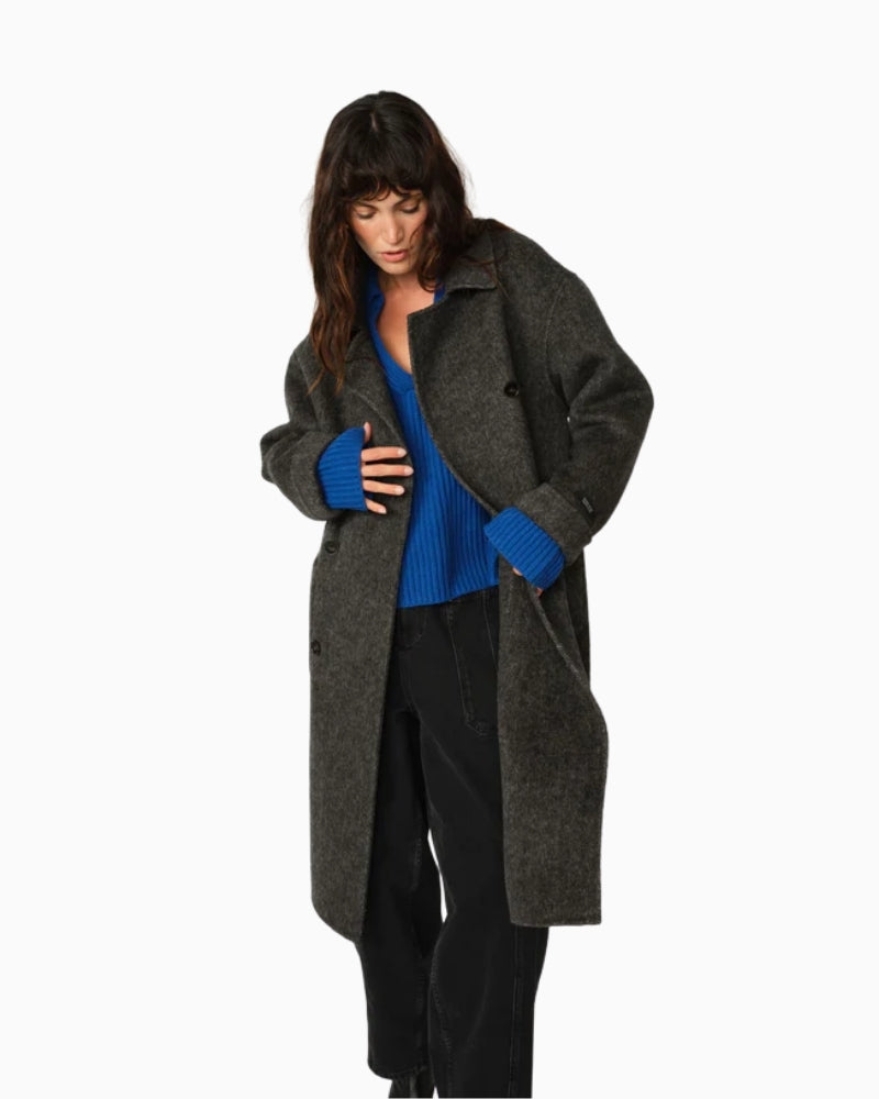 Model wearing Lucca Barkley coat styled over casual jeans