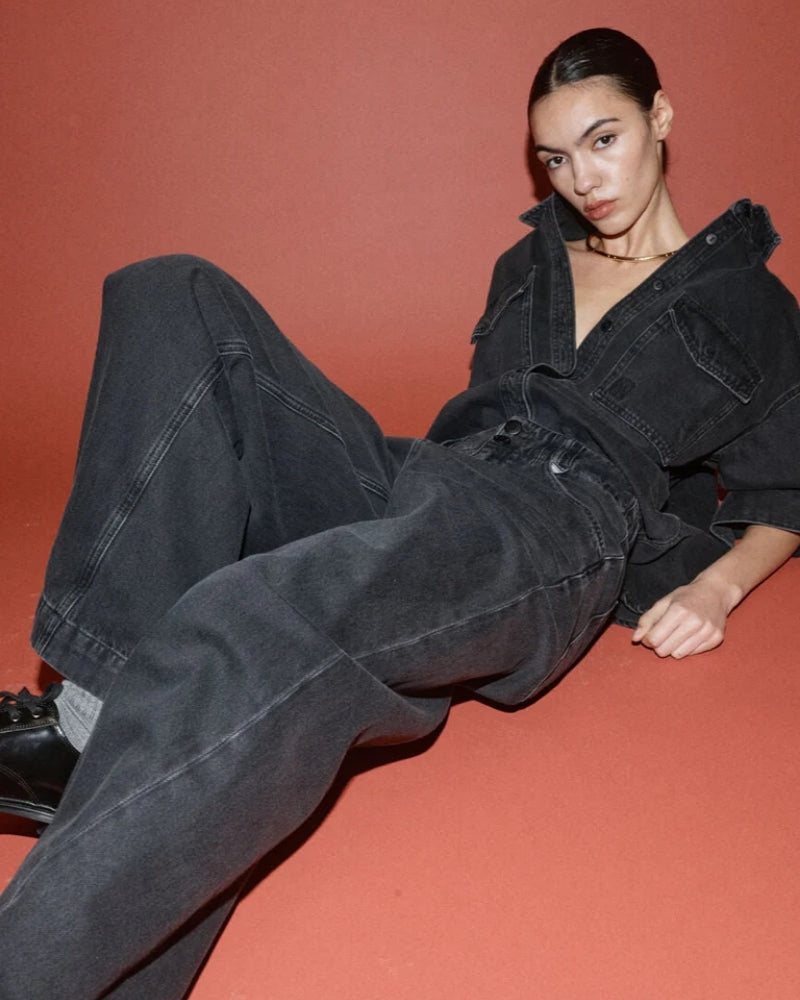 Side view of ankle-length wide-leg cotton trousers