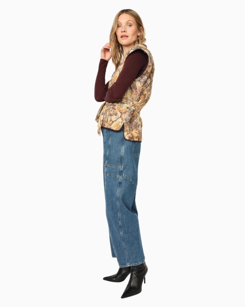 Side view showing waist-tie belt and structured silhouette on Mos Mosh vest