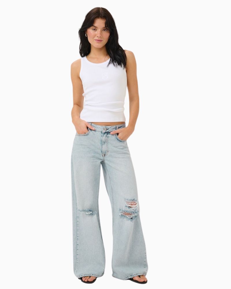 DangoMW jeans styled with tucked-in blouse and casual footwear