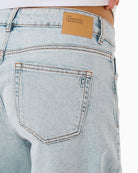 Close-up of soft stretch cotton blend denim in loose fit silhouette