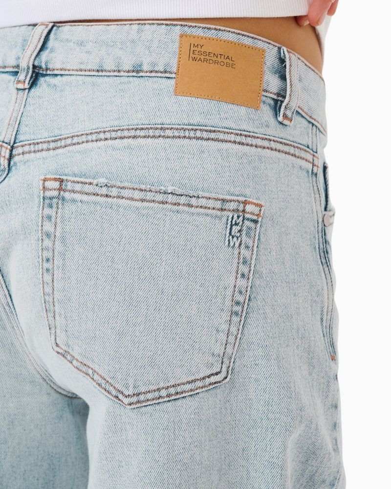 Close-up of soft stretch cotton blend denim in loose fit silhouette