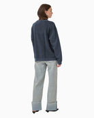 Back view of long sleeve crewneck sweatshirt with dropped shoulders