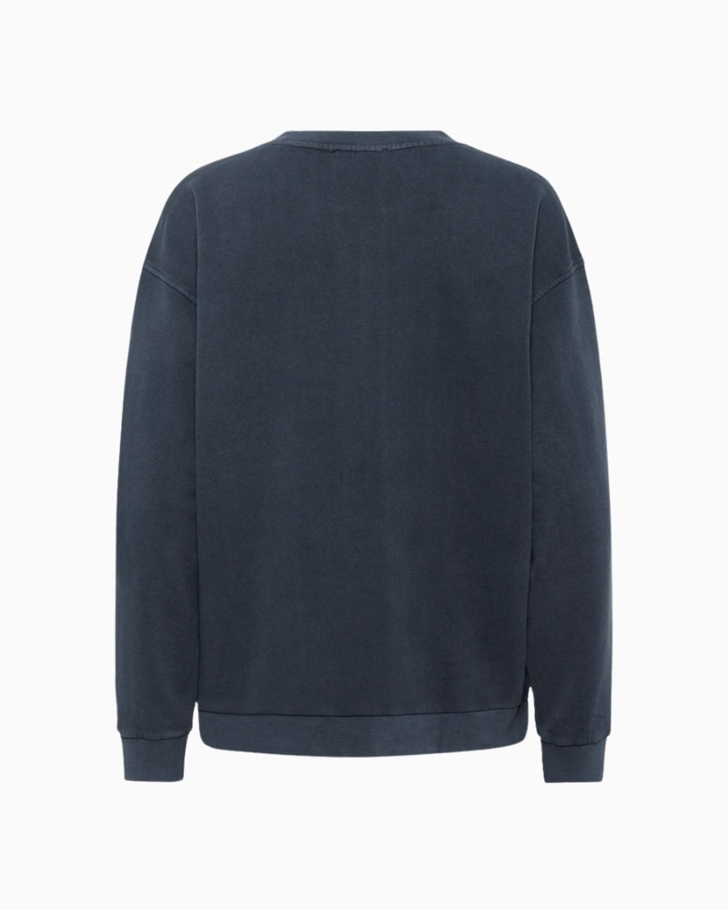 Back view of long sleeve crewneck sweatshirt with dropped shoulders