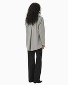 Back view of tailored blazer showing soft seam shaping
