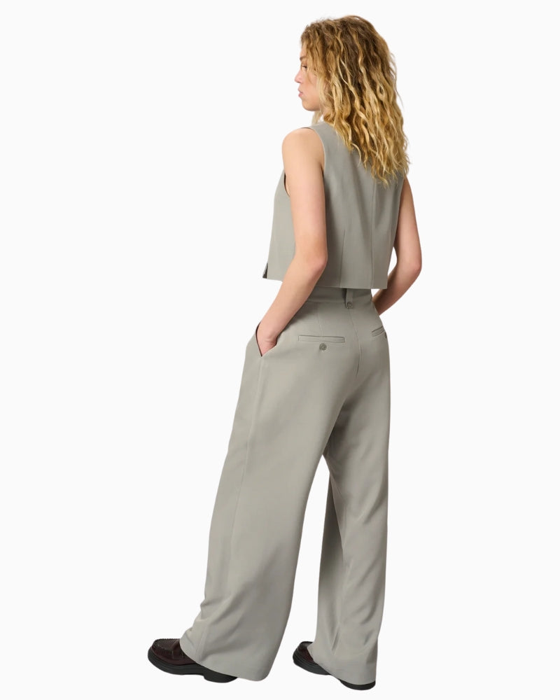 Back view of tailored vest with clean seam detailing