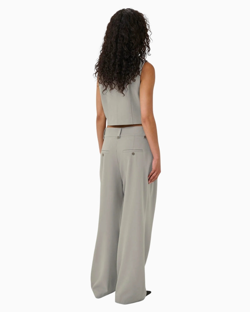 Back view of tailored vest with clean seam detailing