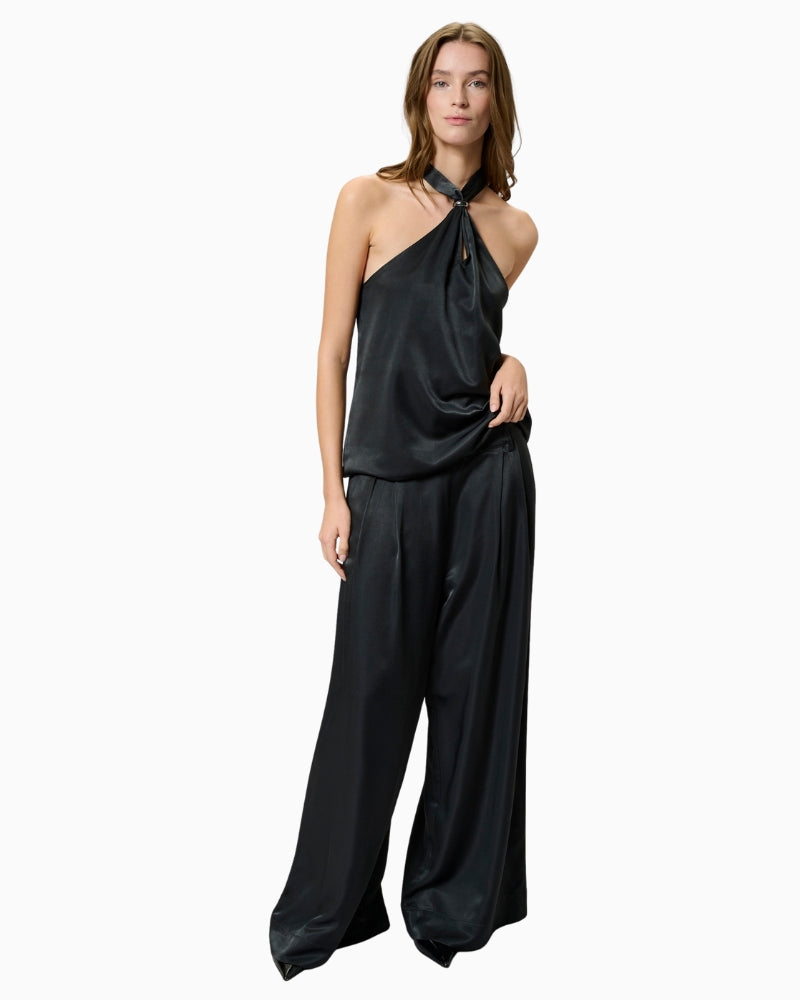 Model wearing Estelle trousers with a blouse and heels