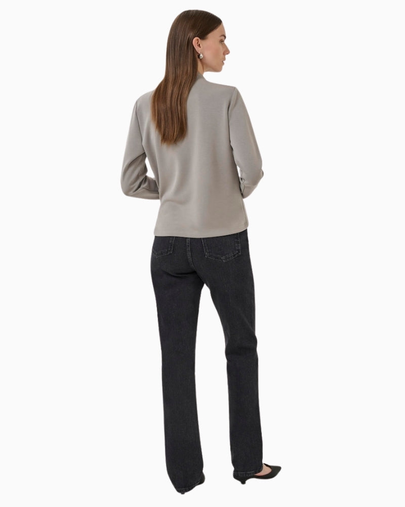 Back view of hip-length TENCEL™ blend blouse with smooth silhouette