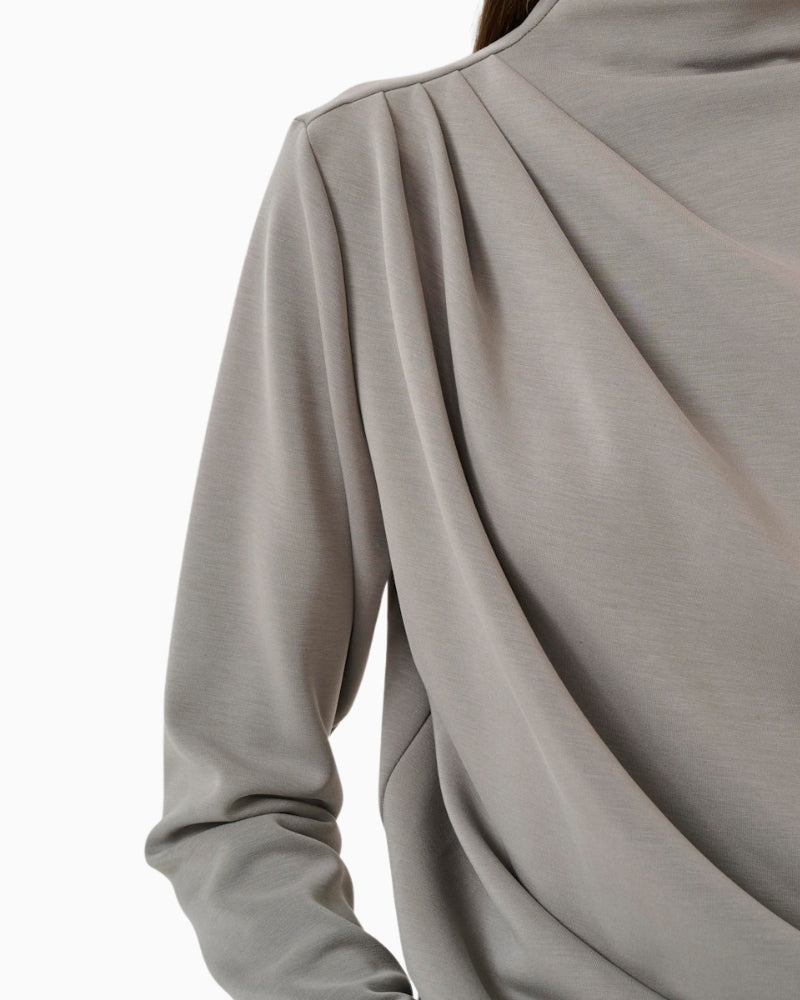 Close-up of neckline and draped front detail on HelleMW blouse